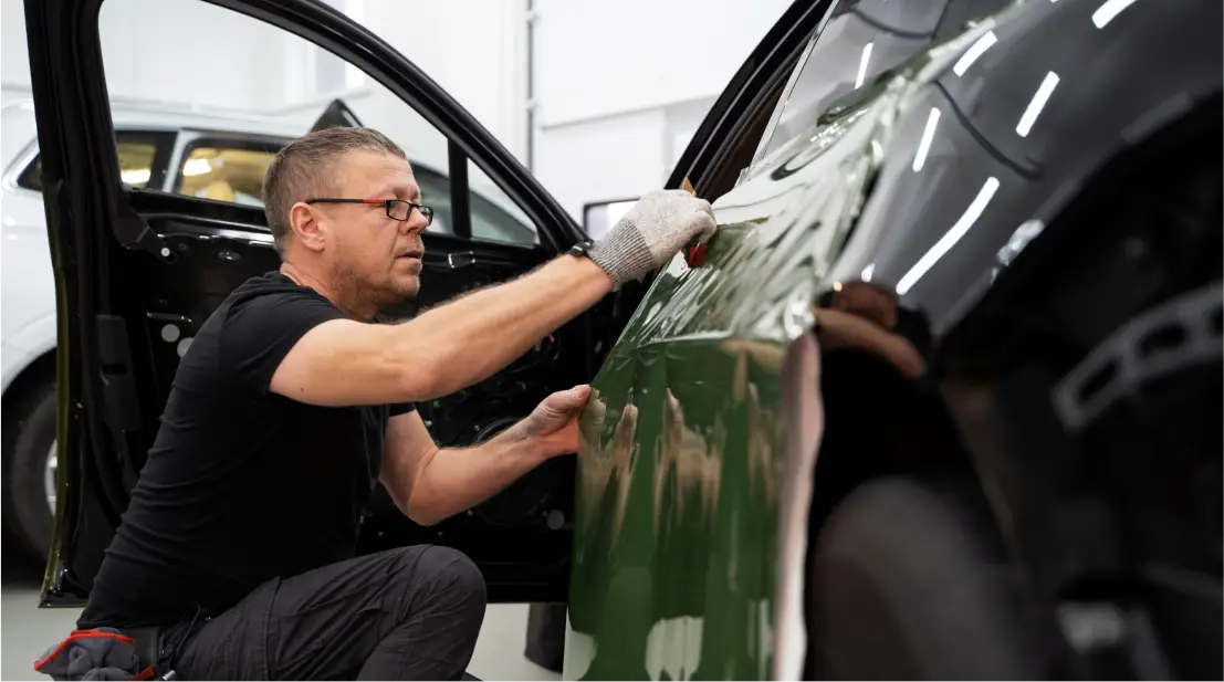 a man wrapping the vehicle