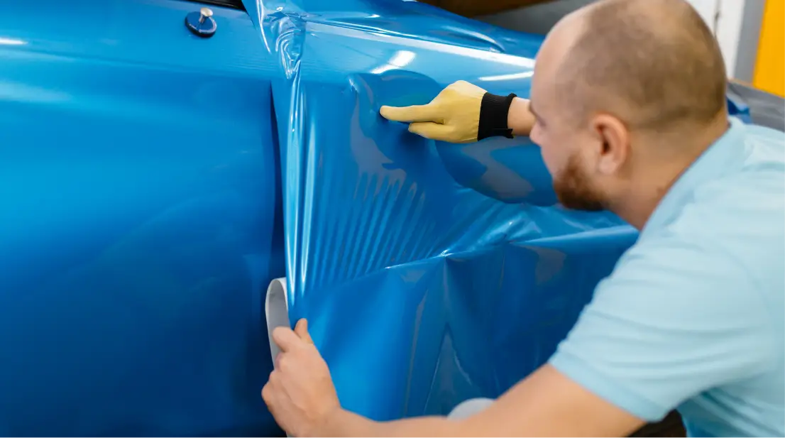 a man wrapping the vehicle