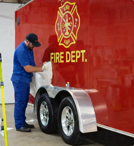 a man wrapping the fire truck